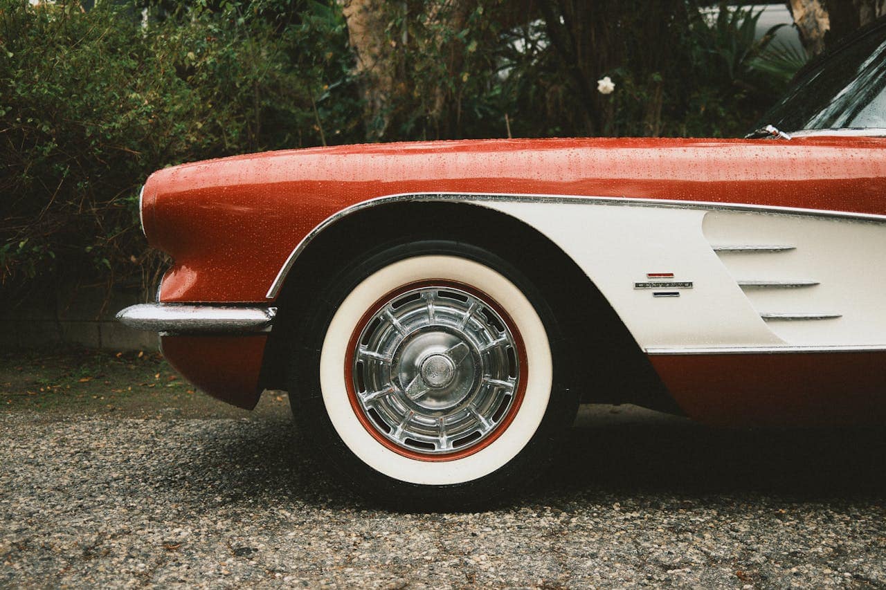 Detailed shot of the front side with chrome accents and whitewall tire.