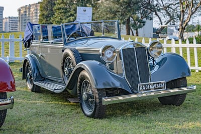 menu-10 Elegant vintage car displayed at a Gurugram auto show, showcasing timeless design and classic aesthetics.